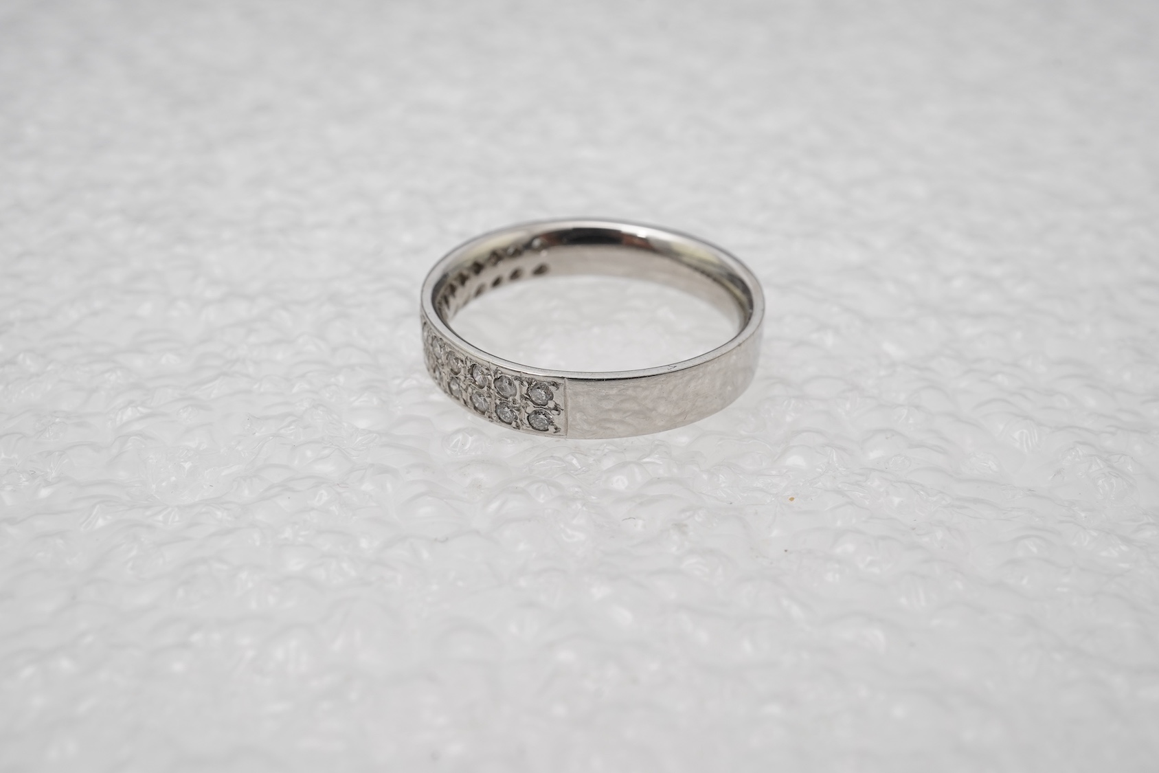 A diamond half eternity ring